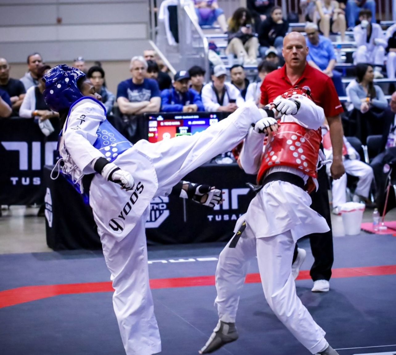 Miles landing a kick at USA Taekwondo Nationals