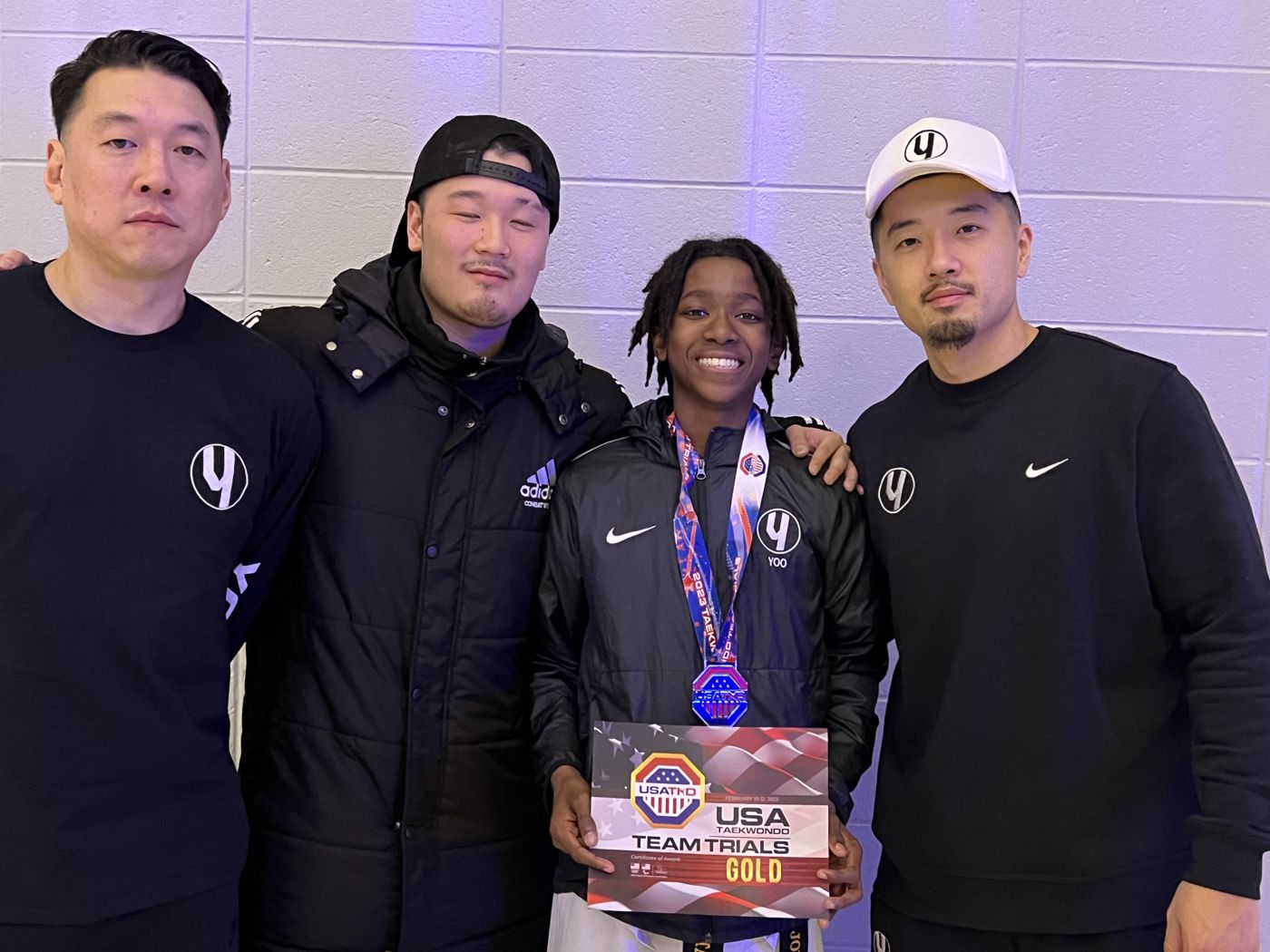 Miles with his coaches after winning gold at USA Taekwondo Team Trials